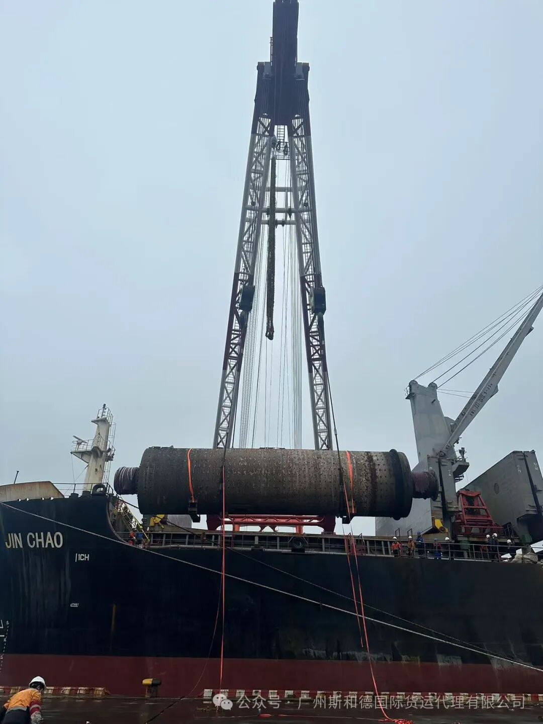 Heavy lift vessel crane loading break bulk project cargo destined for Africa, managed by SPEED INT'L.
