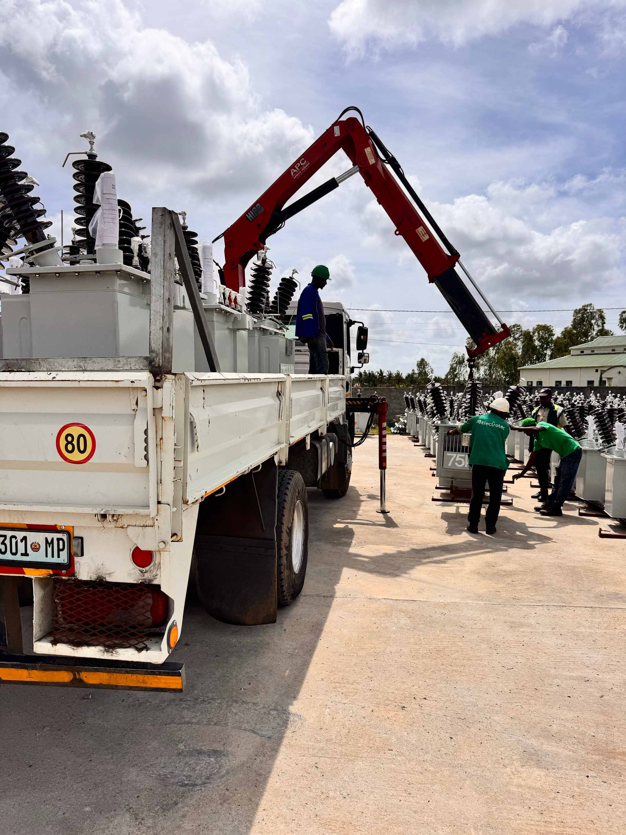 Specialized crane truck facilitating the offloading of transformers at the Ethiopian warehouse