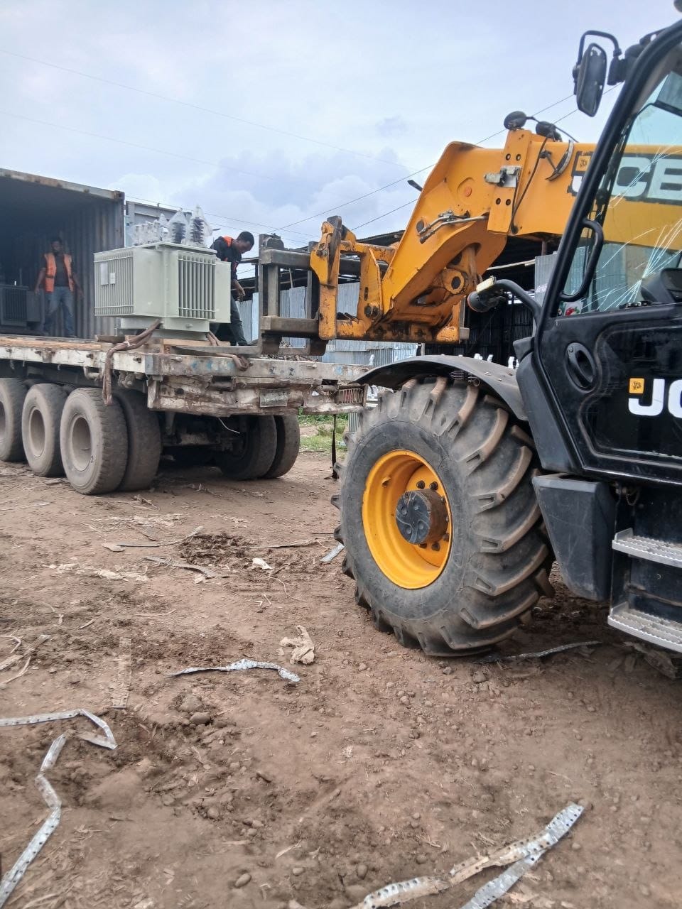 Heavy forklift maneuvering a substation transformer component during Djibouti to Ethiopia transit
